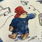 Housse de coussin en tapisserie de haute qualité représentant l'Ours Paddington.