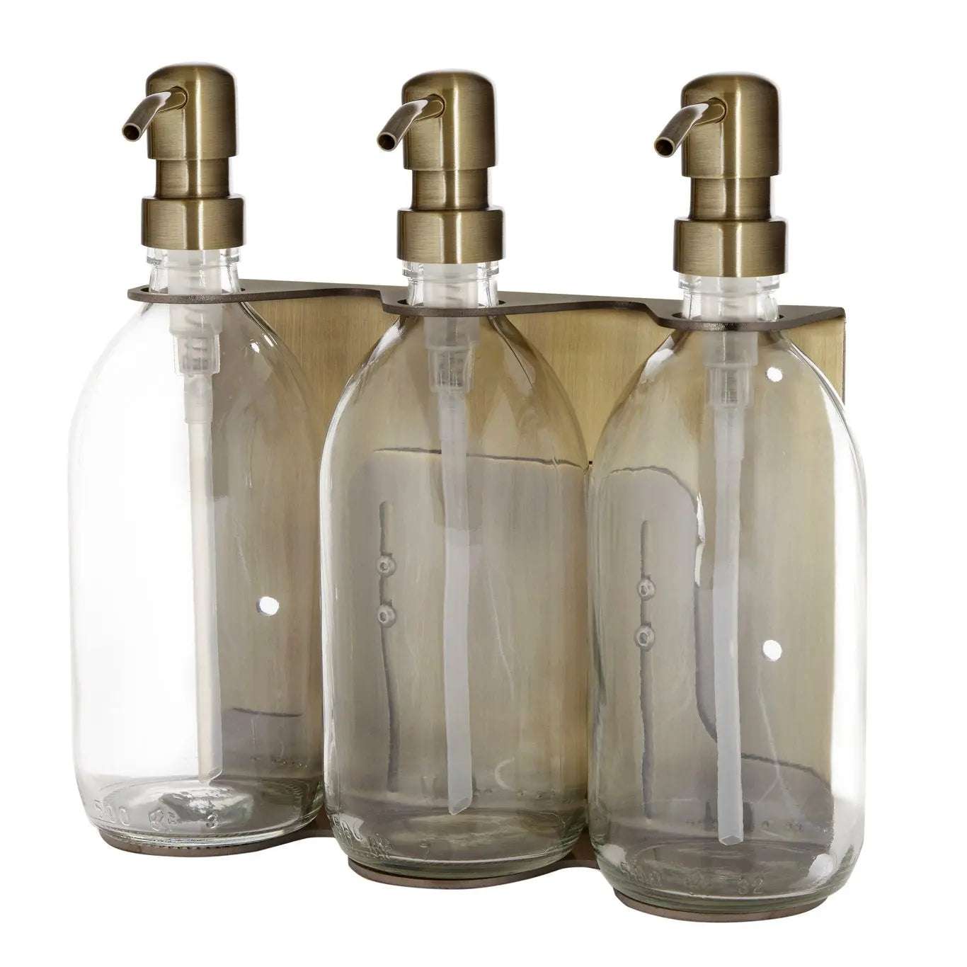 Triple distributeur de savon mural avec flacons verre transparent et pompe dorée.