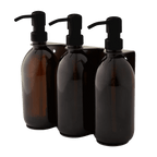 Triple distributeur de savon mural avec flacons verre ambré et pompe noire.